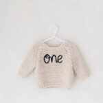 ONE jumper part of the studio wardrobe for first birthday photoshoots.