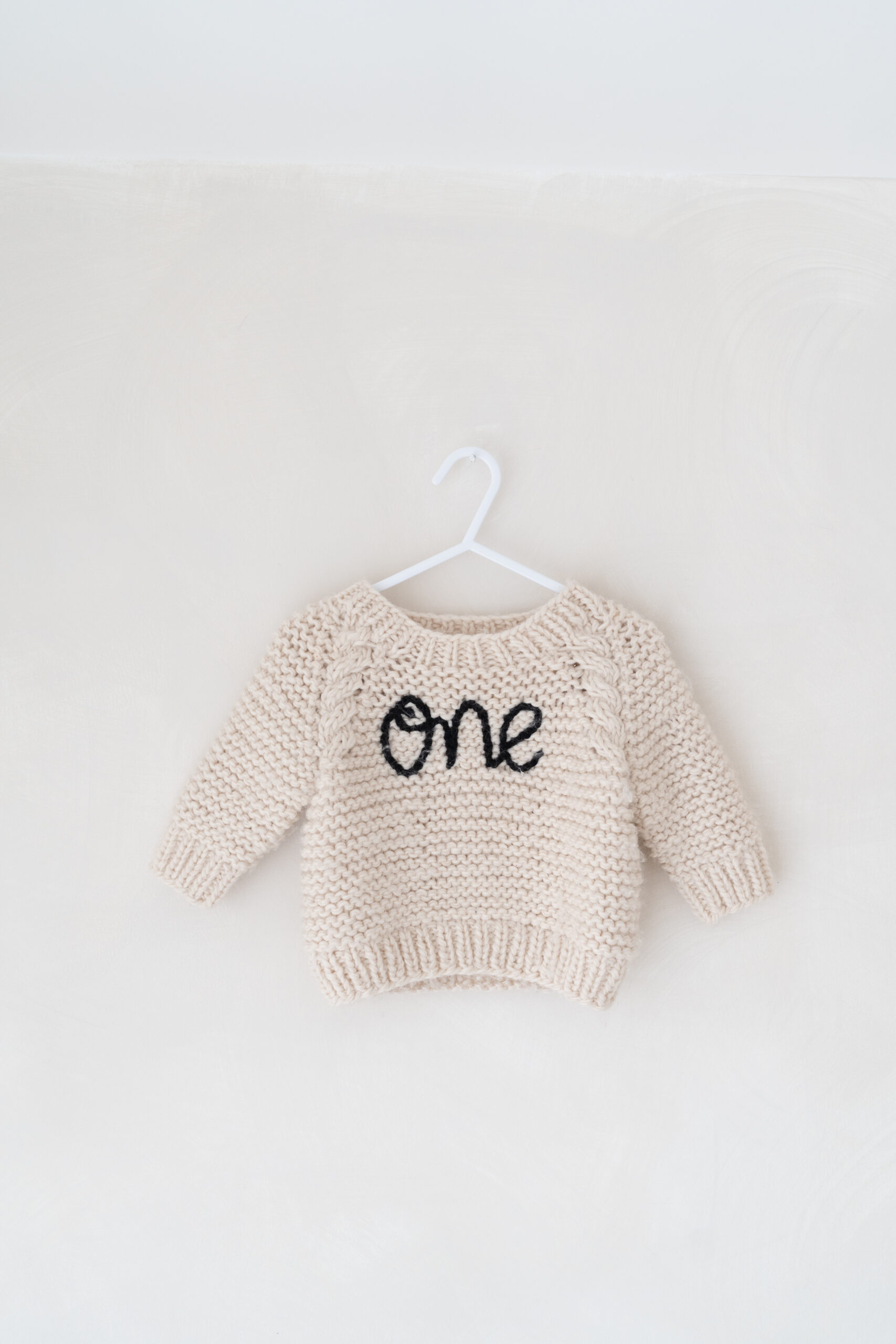 ONE jumper part of the studio wardrobe for first birthday photoshoots.
