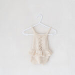 Knitted newborn baby girl outfit in our photography studio in Cheshire