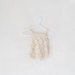 Baby girl knitted romper from studio wardrobe