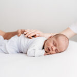 Sleeping newborn baby on photoshoot