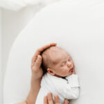 Newborn baby asleep on newborn photoshoot