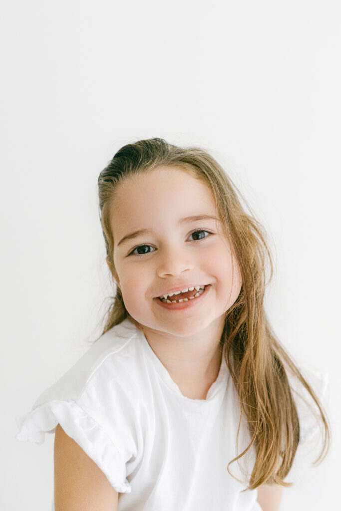 Smiling girl on a family photoshoot