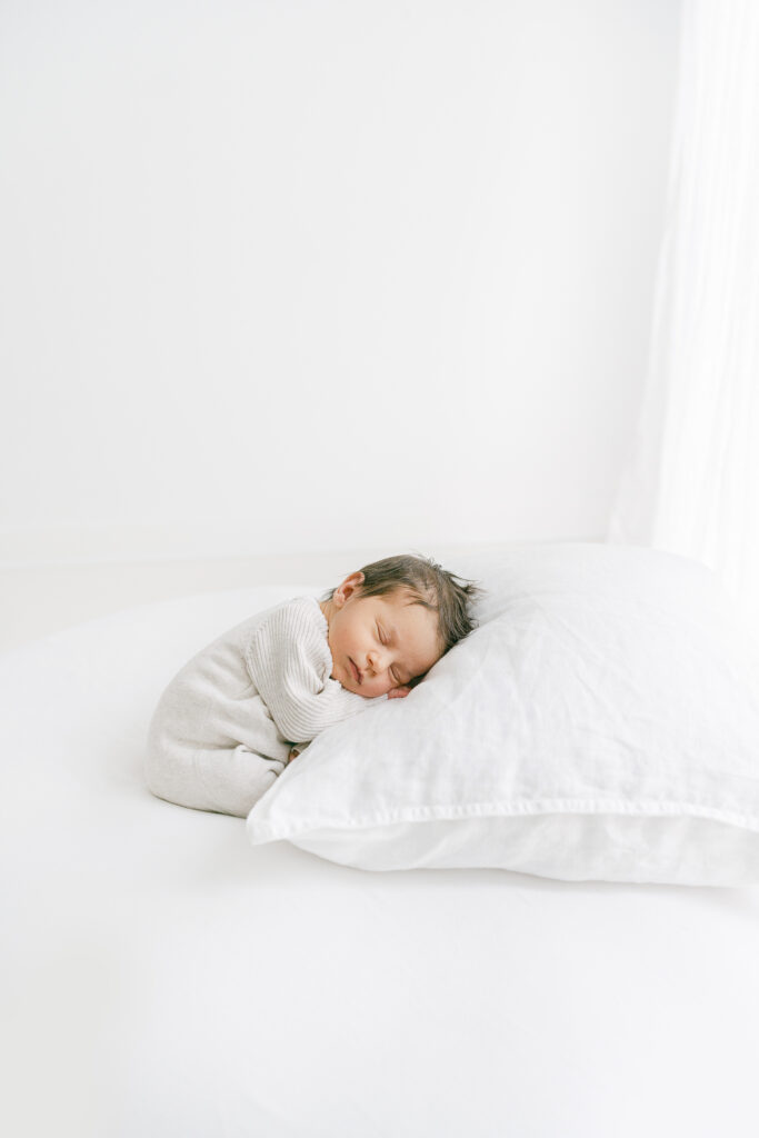 beautiful newborn girl sleeping on her newborn photoshoot.