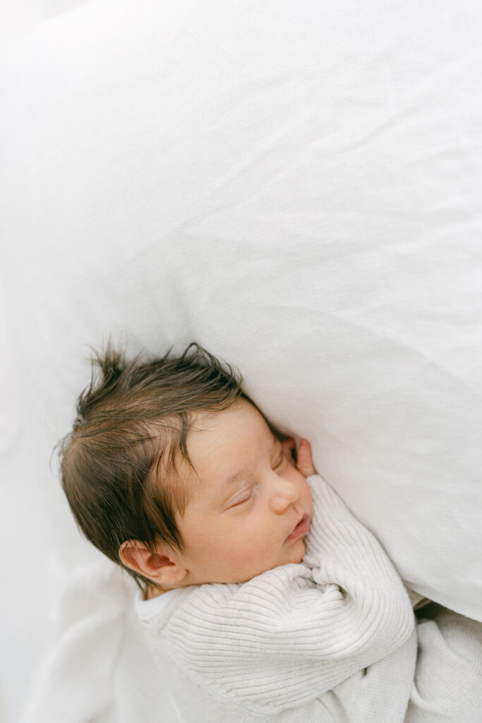 Gorgeous newborn baby sleeping on her newborn photoshoot.