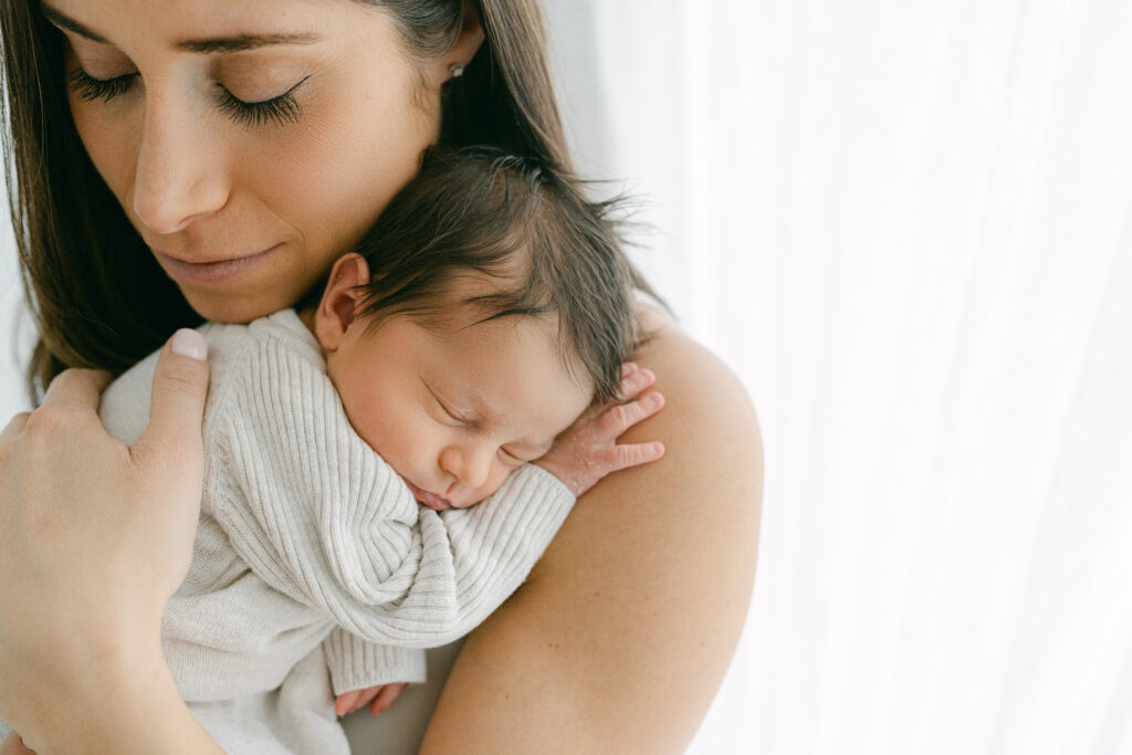 New mother with her newborn on her photoshoot near Wilmslow