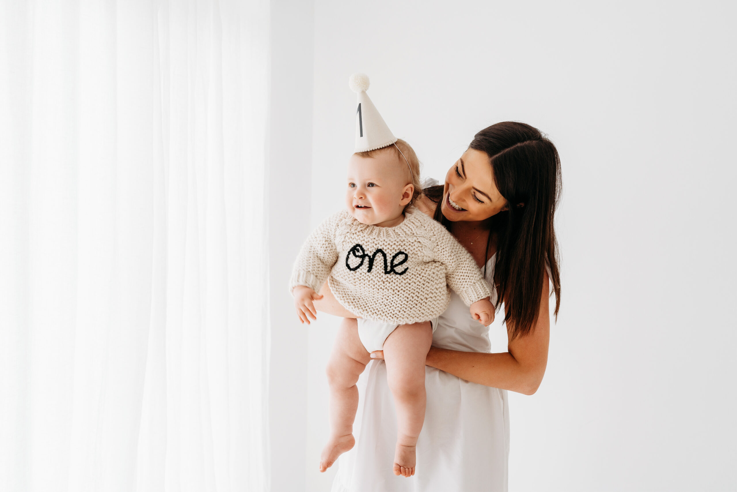 Baby boy and mother on cake smash photoshoot in Cheshire