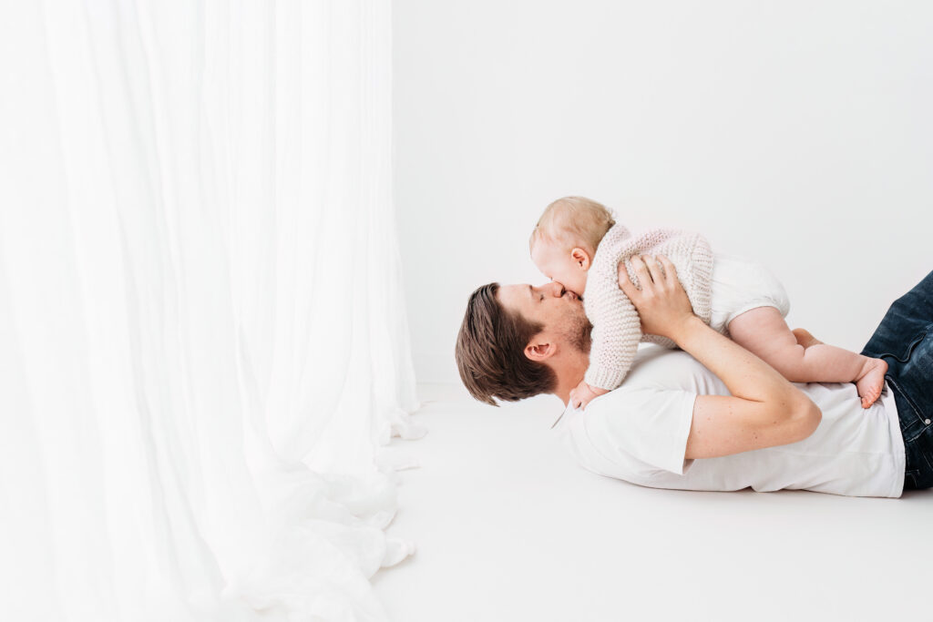 Baby boy and father on cake smash photoshoot in Macclesfield