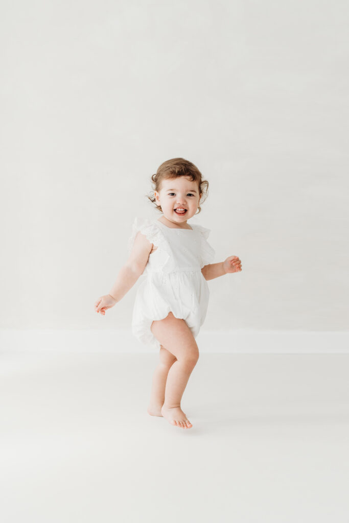 Dancing little girl on her toddler photoshoot in Cheshire