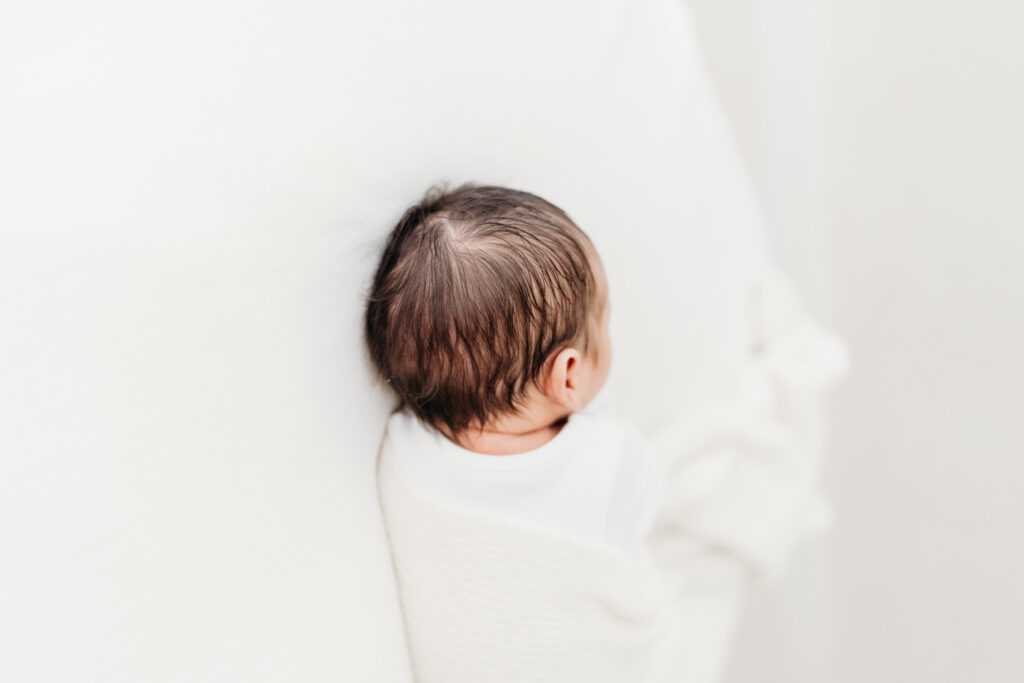 Newborn baby asleep on a natural newborn photoshoot in Cheshire