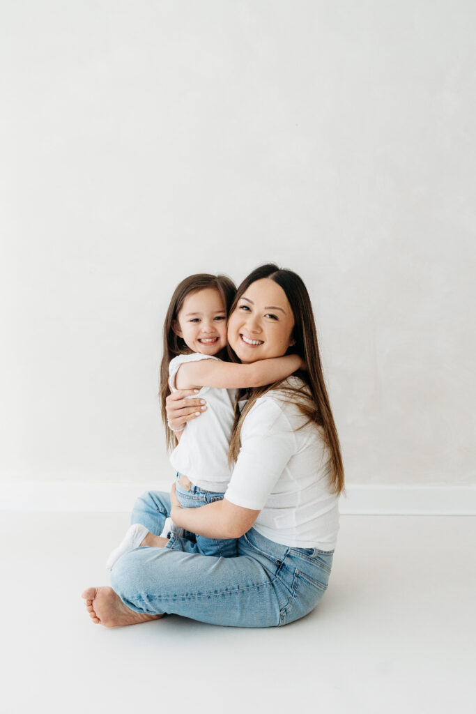 Mother and daughter cuddling on a family photoshoot in Cheshire